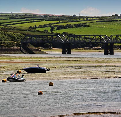 The bridge spans the mouth of Little Petherick Creek, at the point where its waters flow into the River Camel.
