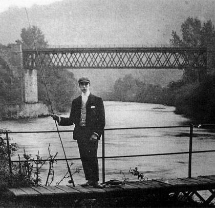 Local carpenter James Edwards, pictured around 1910 with the viaduct's iron river span as a backdrop.