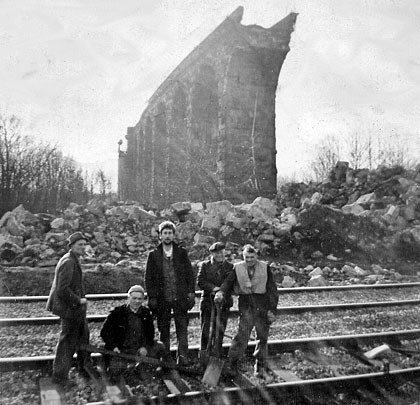 The approach viaduct's demolition crew pose for the camera.