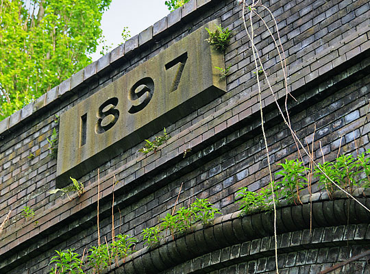 Despite the adorning vegetation, the datestone does not look over a century old.