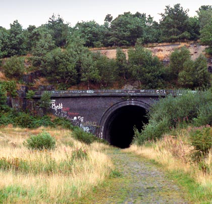 The south portal, now buried beneath landfill, featured a straight headwall looking out into a shallow approach cutting.