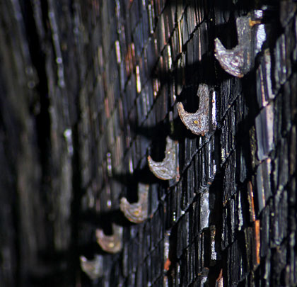 Cable hangers continue at a high level on the north wall.