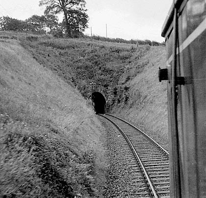 A DMU prepares to tackle the tunnel's curve.