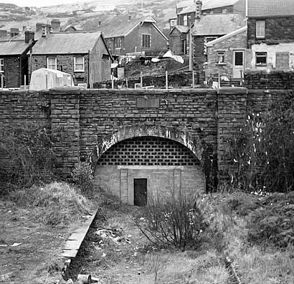 With the platforms still clinging to life, this 1973 view demonstrates the height of the hill through which the tunnel was driven.