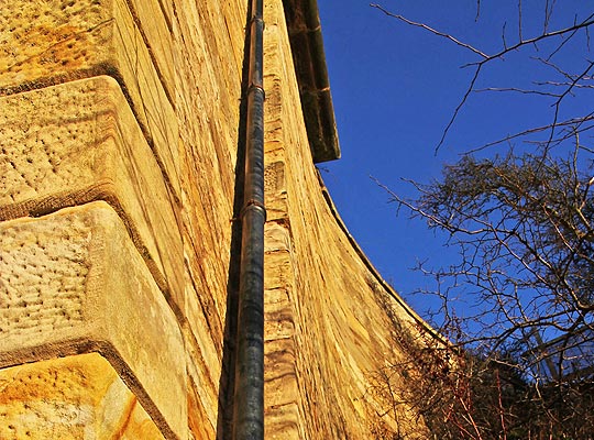 The pilaster and curved wing wall forming part of the western abutment.