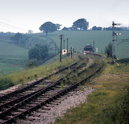 Taken in May 1964, the view south through Severn Bridge Station towards the tunnel's approach cutting.