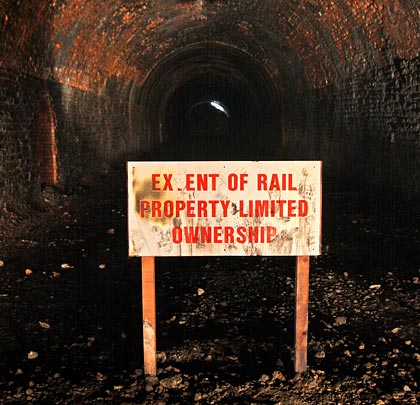 The northern section of the tunnel, beyond a no-nonsense sign, is privately owned.