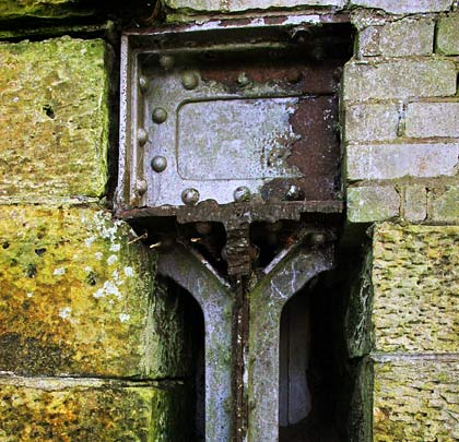 A section of girderwork remains embedded within the abutment.