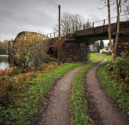An access track to a house passes through the western approach embankment by means of a simple bridge.