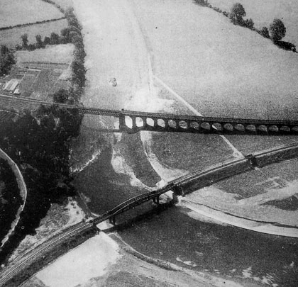 A classic aerial view showing the converging structures on their approach to Monmouth Troy, out of shot on the right.