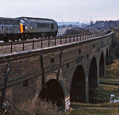 BR Sulzer Type 4 No. 45062 crosses the viaduct with a Bescot-Severn Tunnel Junction freight on 15th December 1983.