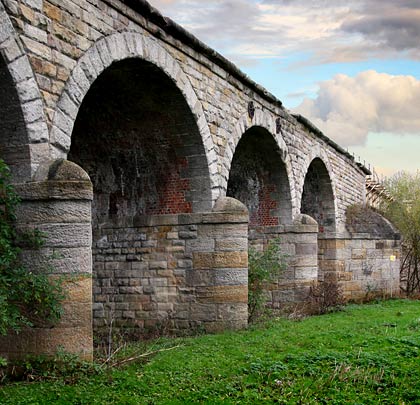 Although the stonework is clearly well crafted, loss of the parapet and part of the string course give the viaduct an untidy appearance.