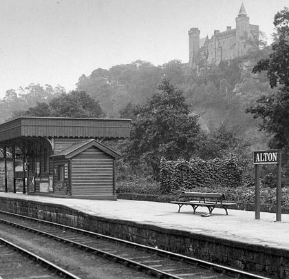Alton Castle looms over the northbound waiting shelter. There is a third platform on the far side of it.