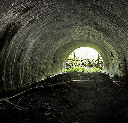 The view into the daylight at the east end where the tunnel is both drier and in generally better condition.