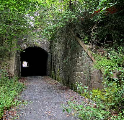 Either side of the unobtrusive portal are wing walls, most substantial on the north side, below the road.