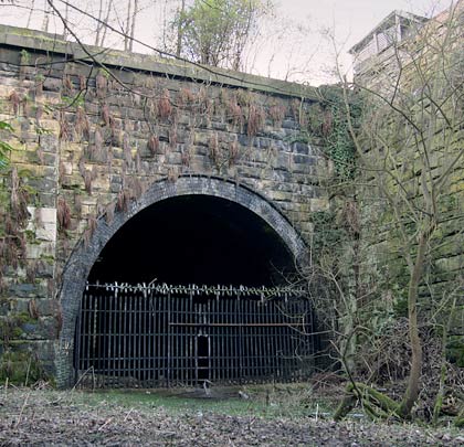 The east portal is less impressive than its sibling and is joined at its north end to a substantial retaining wall.