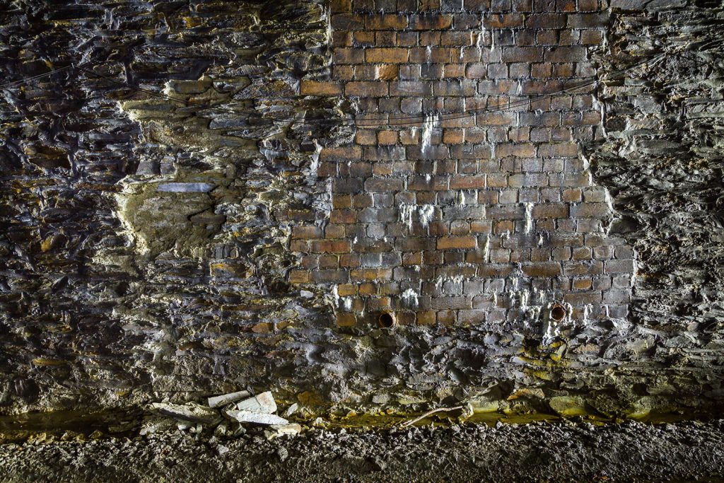 Patch brickwork repairs have been carried out to the sidewall at some locations.