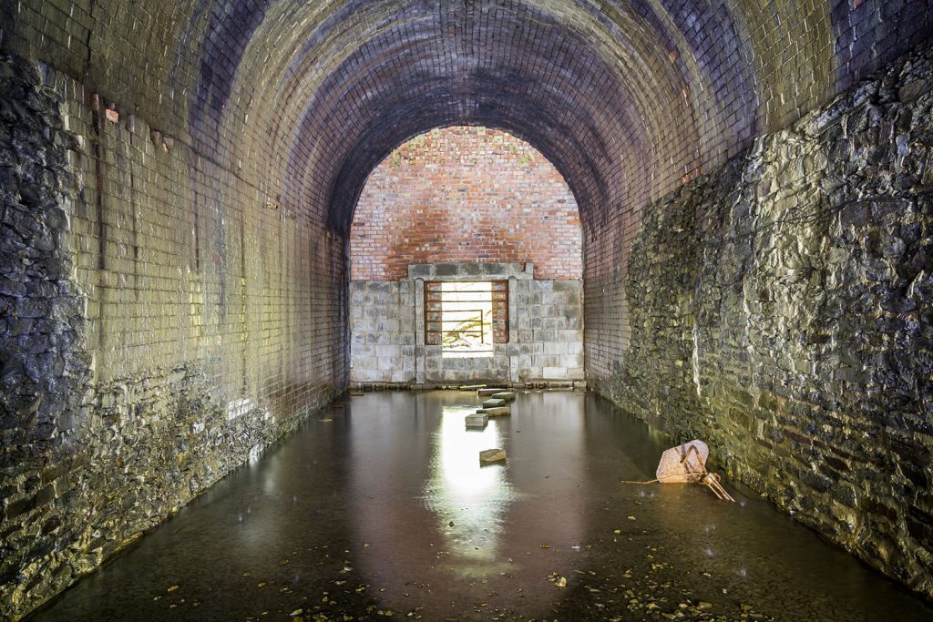 Water pools at the north portal where brickwork repairs have been carried out.